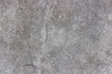 weathered cracked grey concrete surface