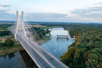 Road bridge with pylons, large road bridge and dam in the background. Wroclaw, Poland