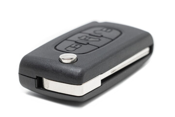 Obraz premium Car key with central locking and alarm buttons on a white background