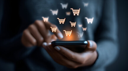 A person using a smartphone for online shopping, with shopping cart icons floating above, representing e-commerce and modern retail.