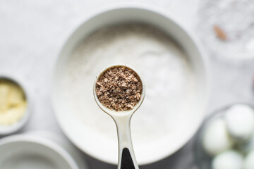 Overhead view of freshly grated Nutmeg in a teaspoon