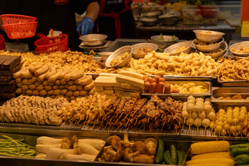 the quintessential scene of a Salty Crispy Chicken (Xian Su Ji) stall in a Taiwanese night market