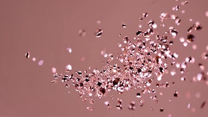 Gorgeous rose gold gems and crystals gracefully cascading and hovering in slow motion on a soft pastel pink backdrop, producing a lavish and festive abstract sight - Powered by Adobe