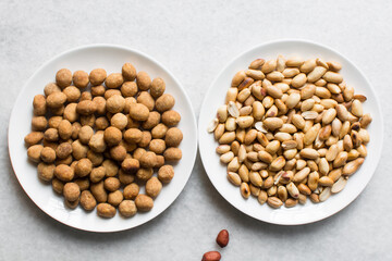 Overhead view of coated peanuts and cracker peanuts on a marble countertop, top view of nigerian peanut snack