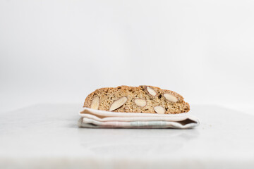 almond biscotti on a white plate, almond cantucci cookies on a white plate