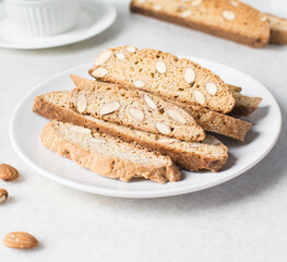 almond biscotti on a white plate, almond cantucci cookies on a white plate