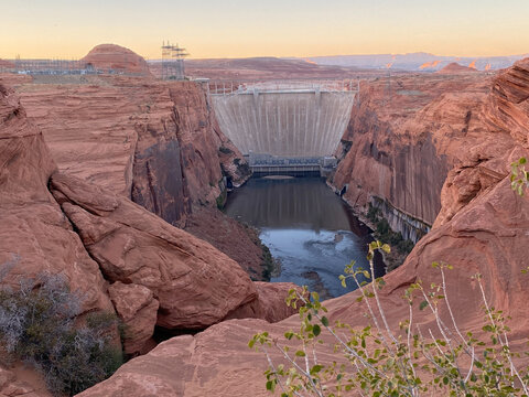 Glen Canyon Dam and Bridge in Page, Arizona. A concrete arch-gravity dam built by the Bureau of Reclamation on the Colorado River forms Lake Powell within Glen Canyon National Recreation Area.