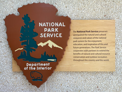 United States National Park Service arrowhead emblem and mission statement. NPS is a Federal agency of the US Department of the Interior. 