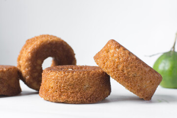 close up view of mini vanilla cakes on a white countertop, mini vanilla bundt cakes on a white background