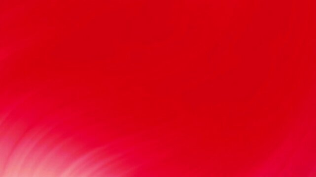 Abstract red background with glowing light streaks and smooth flowing motion