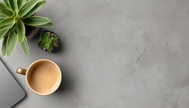Top View Of Office Workplace Featuring Laptop, Coffee Cup, And Potted Plant On Grey Background With Ample Copy Space Available.