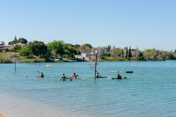 Fototapeta premium People playing canoe polo on Arcos de la Frontera dam in Spain