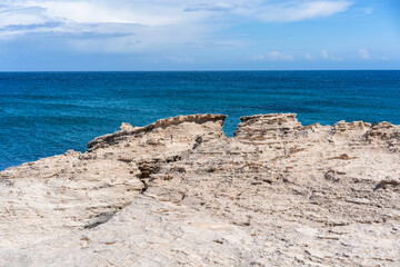 Los Escullos Beach showing rugged rock formations meeting the deep blue ocean in Cabo de Gata, Spain