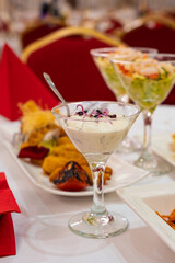 Vilnius, Lithuania - May 9 2025 - A close-up shot of appetizers and cocktails served at a formal event.