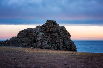 Rocky coastal landscape at Cabo de Gata with evening sky showing colorful twilight in Spain