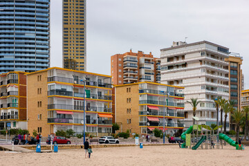 Poniente beach with tall buildings and playground in Benidorm, S
