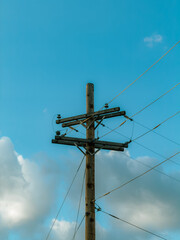 Fototapeta premium high voltage power lines against blue sky