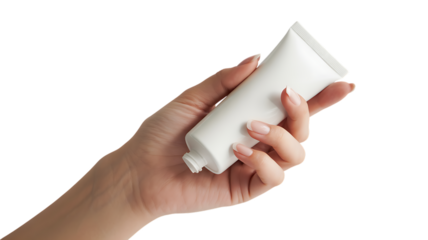 Woman's hand holding a white cosmetic cream tube with manicured nails isolated on a transparent background