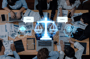 A diverse business team collaborates in a modern workspace surrounded by data charts and digital law symbols, emphasizing teamwork and strategic insight. Trope
