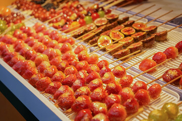 Tanghulu, traditional Chinese snack. Rock sugar-coated strawberries, a favorite Chinese street food.