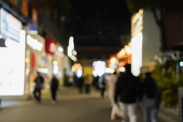 blurred busy fresh market full with crowd people walking in street shopping in winter in Chengdu