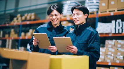 Warehouse inventory checklist and logistics teamwork quality control with clipboard, uniform worker inspection, calm industrial light, shelves and cardboard box foreground, supply chain audit