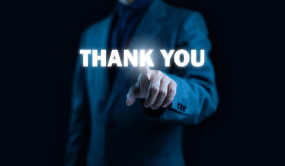 A businessman pointing at a glowing “THANK YOU” text, symbolizing appreciation, gratitude, customer relations, positive communication, professional acknowledgement, and modern digital business.