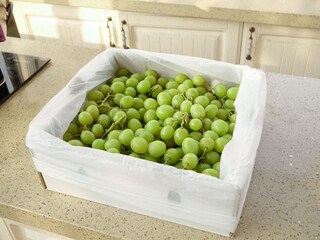 Fresh Green Grapes in Box on Kitchen Counter - Healthy Fruit Harvest