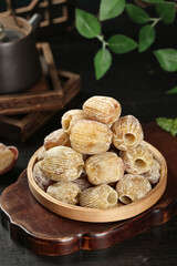 Dried Dates Fruit Without Core in Wooden Bowl - Golden Brown Healthy Natural Snack Food Picture