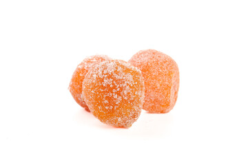 Sugar-coated dried kumquats candied citrus fruit preserves on white background