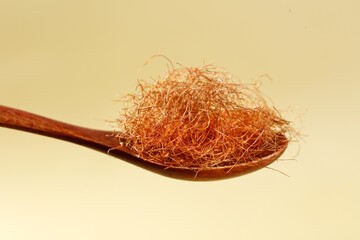 Dried Cornhusk Tea on Wooden Spoon for Herbal Brewing and Natural Health Drinks
