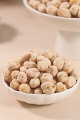 Xinjiang Crispy Salted Fried Chickpeas in White Bowls - Traditional Chinese Snack Food