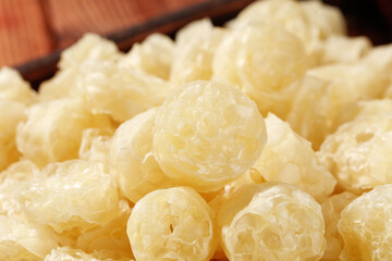 Dried White Fungus Bird's Nest Traditional Asian Cooking Ingredient Close-up in Wooden Bowl