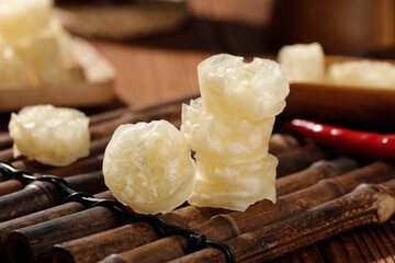 Fresh lotus root vegetables sliced on bamboo mat - traditional Asian cooking ingredient