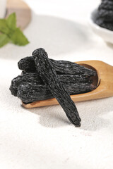 Xinjiang Black Raisins on Wooden Spoon - Premium Dried Fruit from China