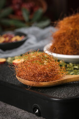 Dried Corn Silk Cornhusk in Wooden Spoon for Herbal Tea Brewing and Natural Health Infusion Drinks