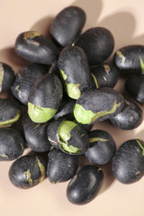 Black Fava Beans with Green Cotyledons in Wooden Bowl - Healthy Legume Food Ingredient