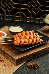 Big Spicy Shaanxi Homemade Gluten Skewers - Traditional Chinese Dry Street Food on Wooden Board