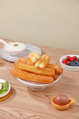Golden Fried Churros Fritters with Berries and Cream on Wooden Table Food Photography