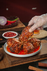 Spicy Chengdu Rabbit Head Dish - Traditional Sichuan Cuisine Chef Preparation with Chili Oil and Peppercorns