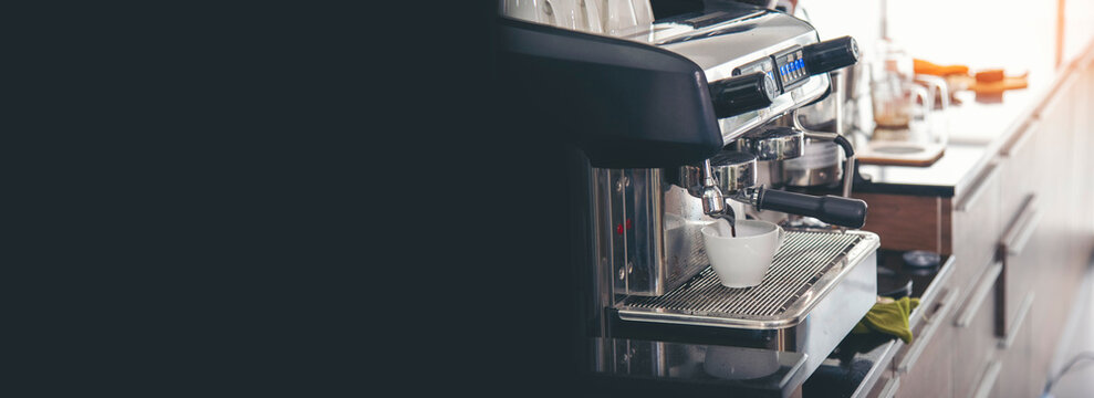 Banner Close up hands coffee barista man make hot cup espresso shot from coffee machine. Banner man hands of barista make black hot Cappuccino milk coffee cup with copy space