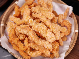 Crispy Golden Fried Pork Rinds and Chicken Strips in Rustic Bamboo Basket - Farmhouse Style Snacks