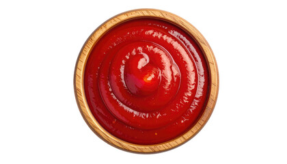 Overhead shot of thick, vibrant red condiment swirling neatly in a light brown, round wooden bowl against a black background