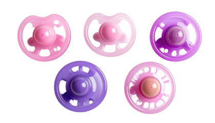 Close-up studio shot presents five pacifiers, each with a different shade of pink and purple, set against a black background