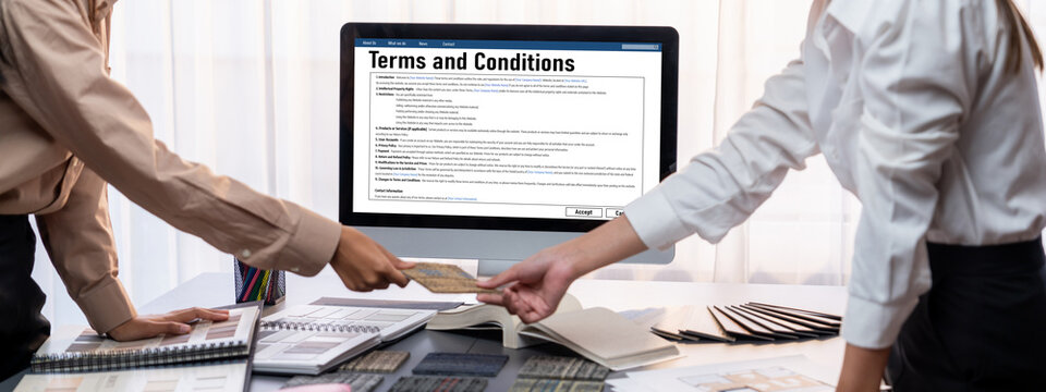 Group of interior architect designer team at table choosing various mood board samples with architecture software on laptop screen. Modern renovation and interior material selection concept. Insight