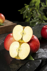 Fresh Red Apples Whole and Sliced on Dark Slate Surface - Healthy Fruit Still Life