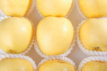 Fresh Golden Yellow Apples in Protective Packaging - Premium Quality Fruit Variety