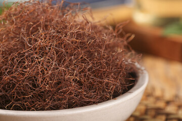 Dried Corn Silk Threads in Bowl for Herbal Tea Making and Traditional Health Remedies
