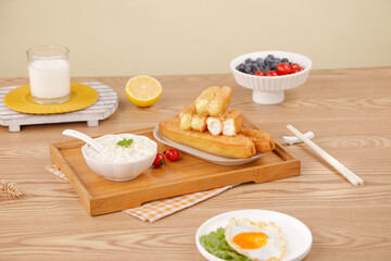 Delicious breakfast combination with bread sticks yogurt berries and sunny casual dining spread