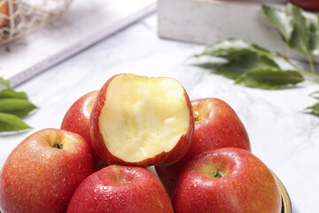 Fresh Red Apples from Shaanxi Province China with Sliced Apple Showing Heart-Shaped Flesh